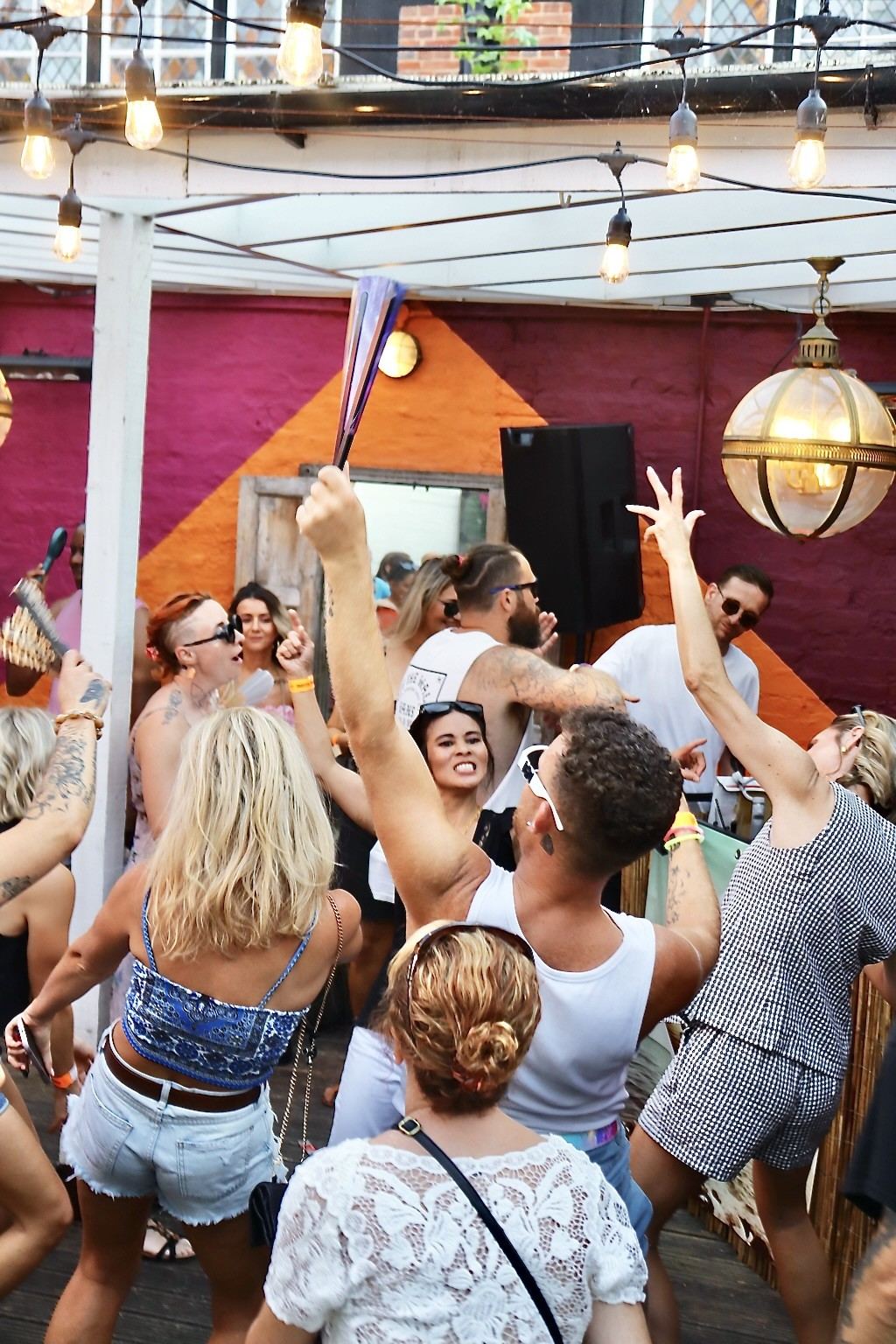Dancers under festoon lights at Seasunal Sessions Endless Summer